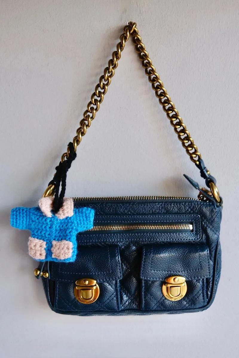 Hand crocheted charm. Blue Jacket